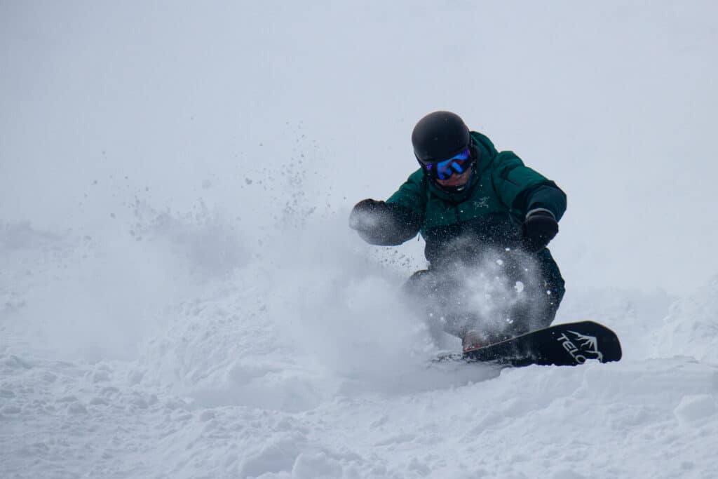 Snowboarding making a pow turn at Willamette Pass